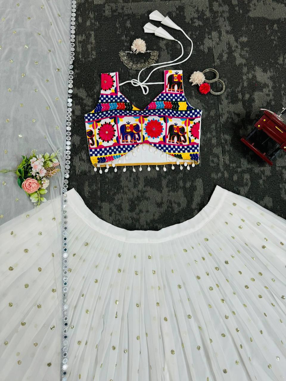 Exquisite Pristine White Designer Lehenga Choli with Vibrant Multicolored Traditional Elephant Embroidery and Mirror Work Detailing